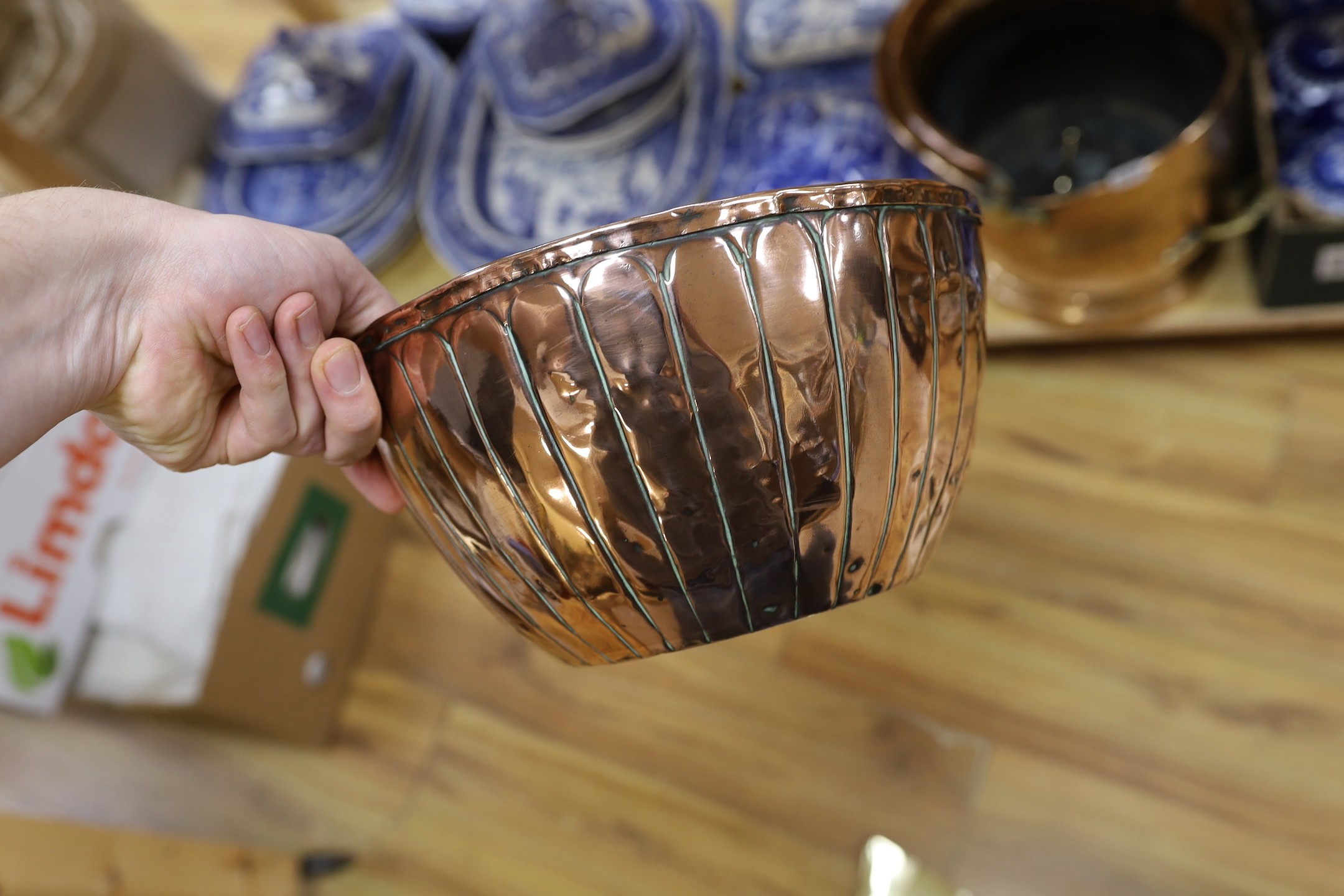 A group of copper and brass including coal scuttle, pestle and mortar etc.